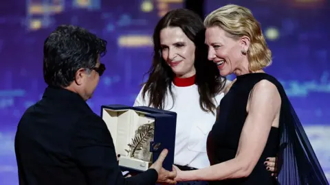 Panahi receiving the award