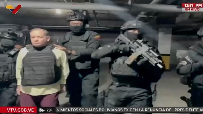 A video still showing Juan Pablo Guanipa being escorted by armed personnel.