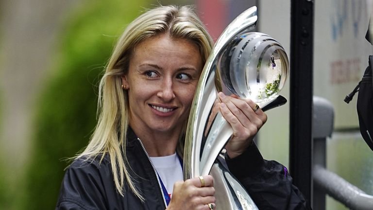 Leah Williamson with the Women's Euros trophy as England departed their team hotel in Zurich