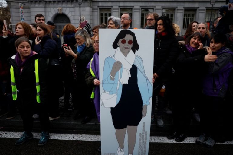 A demonstrator holds a poster honoring Gisele Pelicot, the victim of orchestrated mass rape by her then-husband, during an International Women's Day rally in Madrid, Spain, March 8, 2025. REUTERS/Susana Vera
