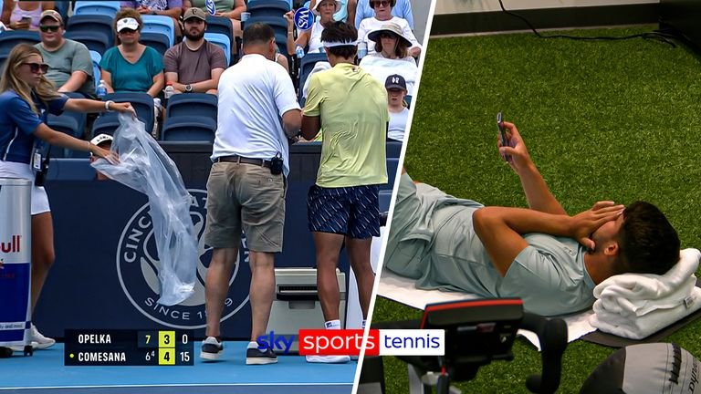 Carlos Alcaraz observes Francisco Comesana as he faces illness courtside